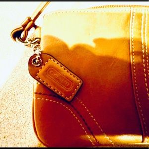 Brown leather coach wristlet
